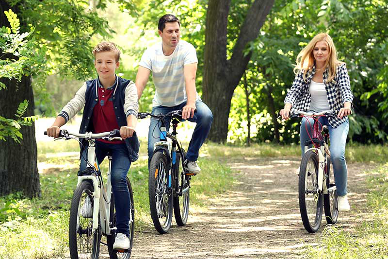 family of three biking